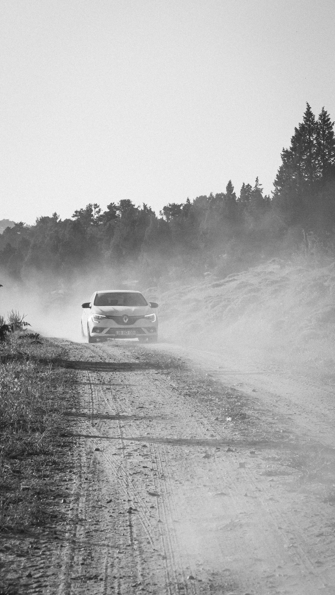 grayscale photo of car on road