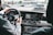 person in gray long sleeve shirt driving car