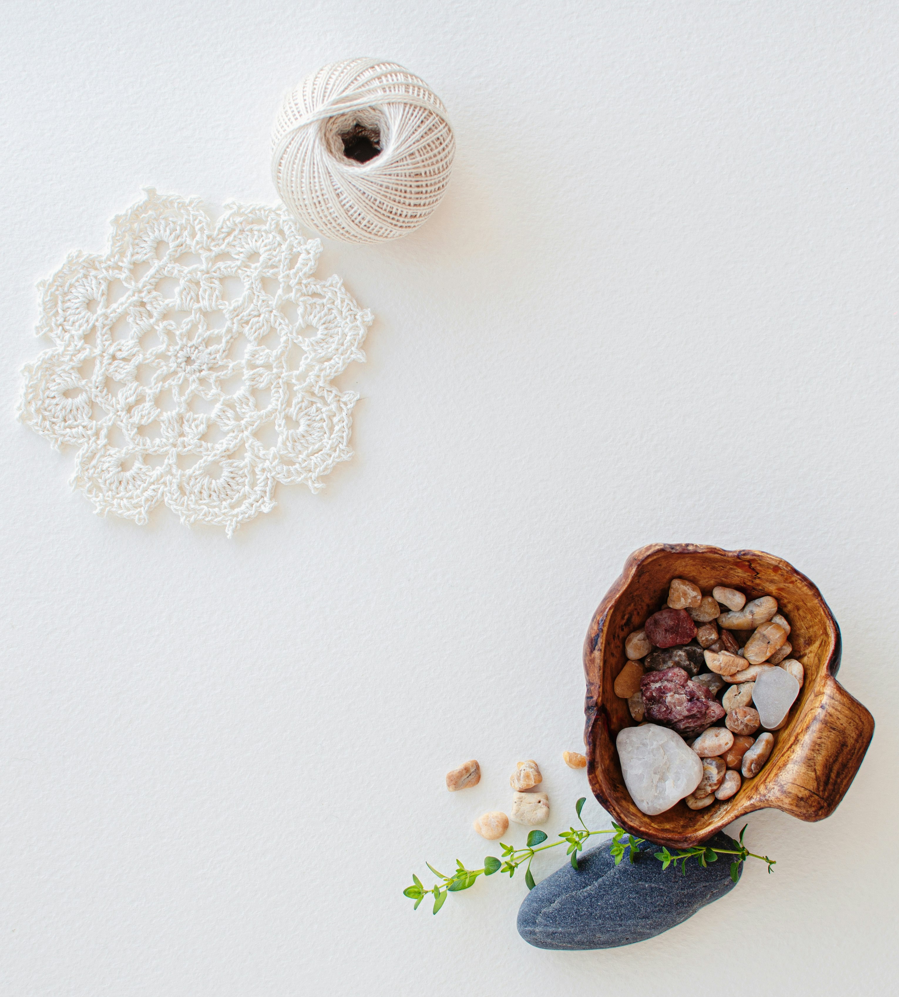 white and brown ceramic vase on white table