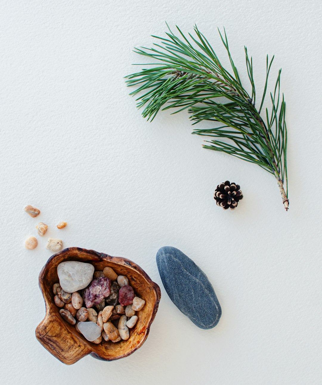 blue and brown heart shaped stones on brown wooden heart shaped tray