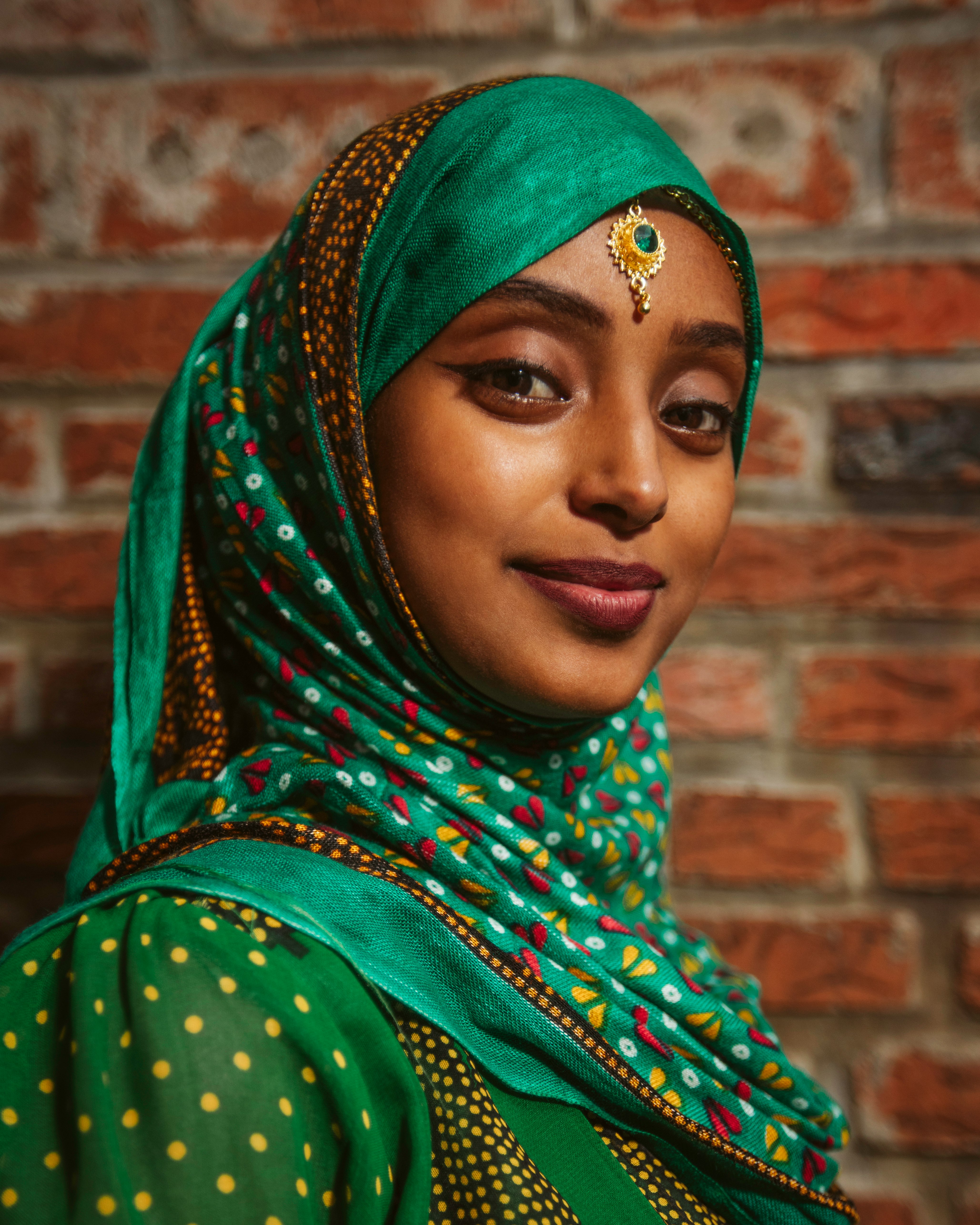 woman in green and brown hijab