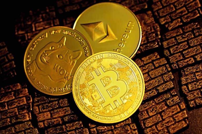 gold round coin on brown textile