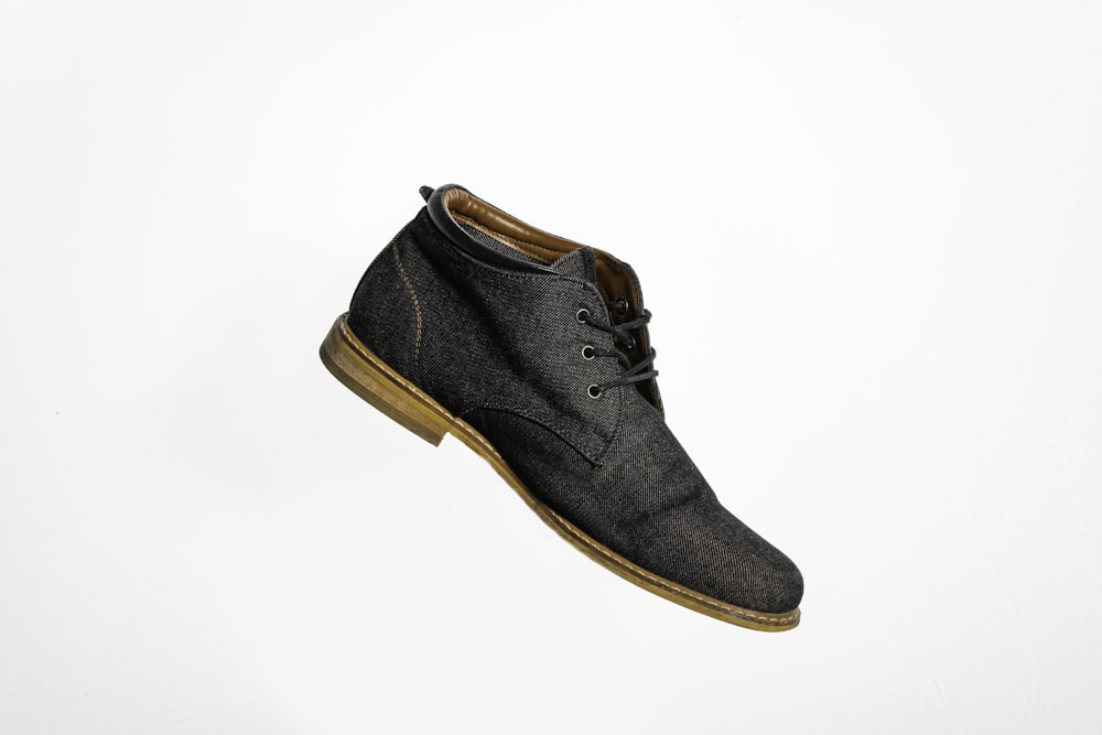 black and brown lace up shoe