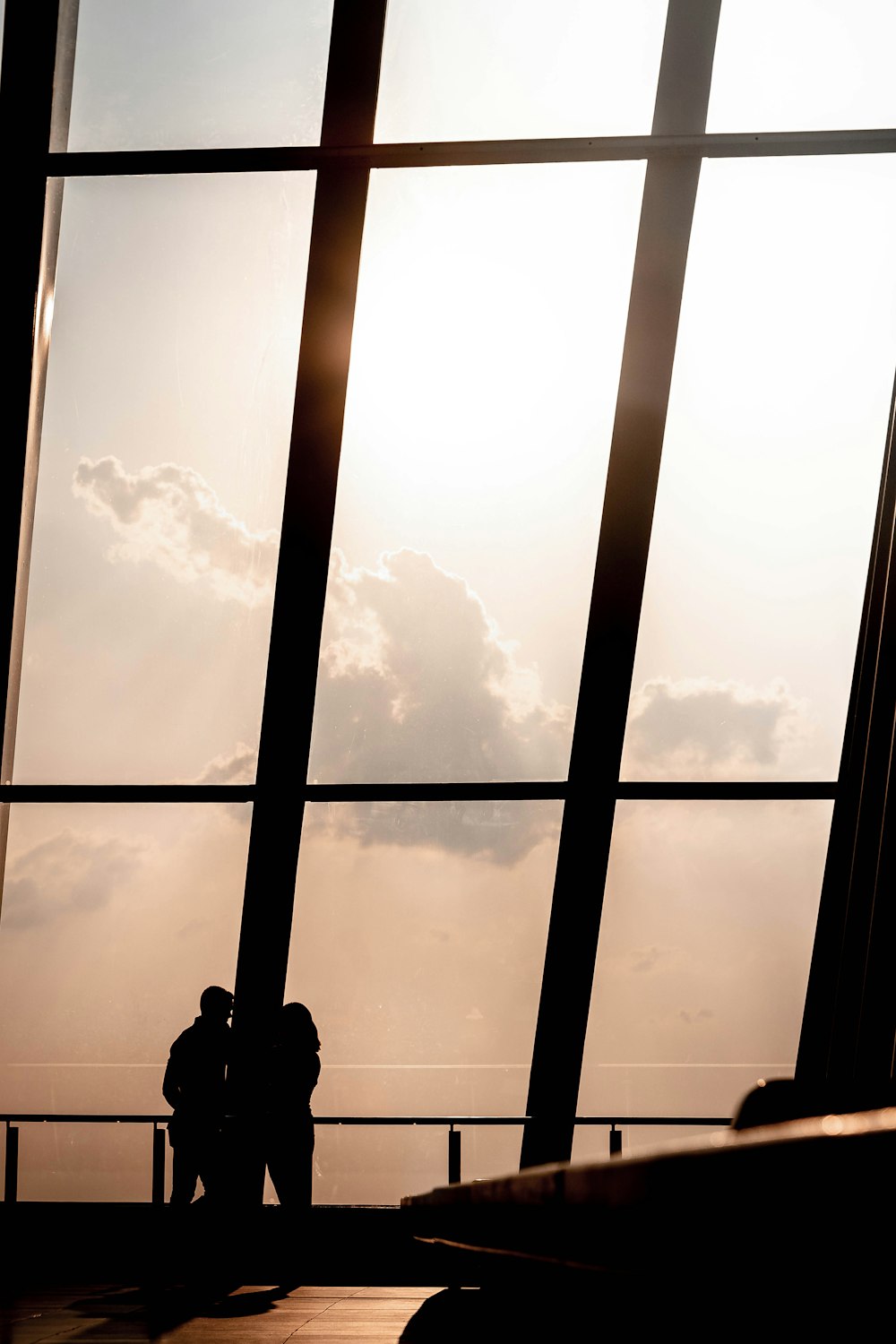 silhouette of man standing on the window