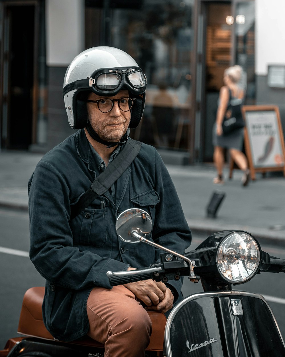 man in black jacket and helmet riding motorcycle