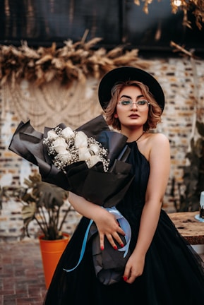 woman in black and white floral dress
