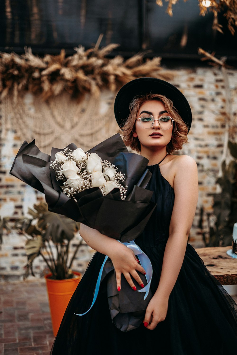 woman in black and white floral dress