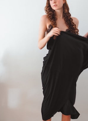 Curly human hair displayed against a soft neutral background.