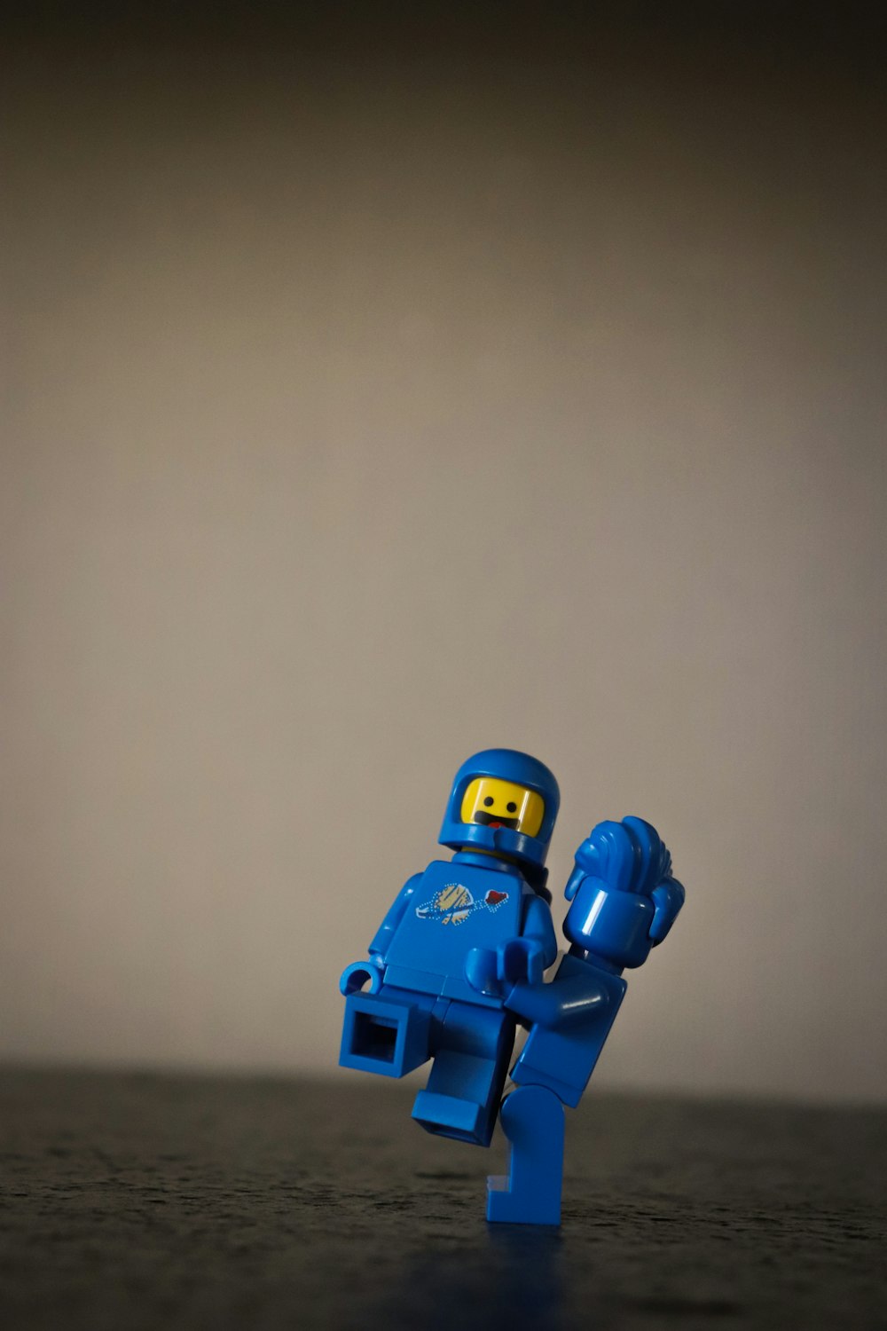 blue lego minifig on white surface