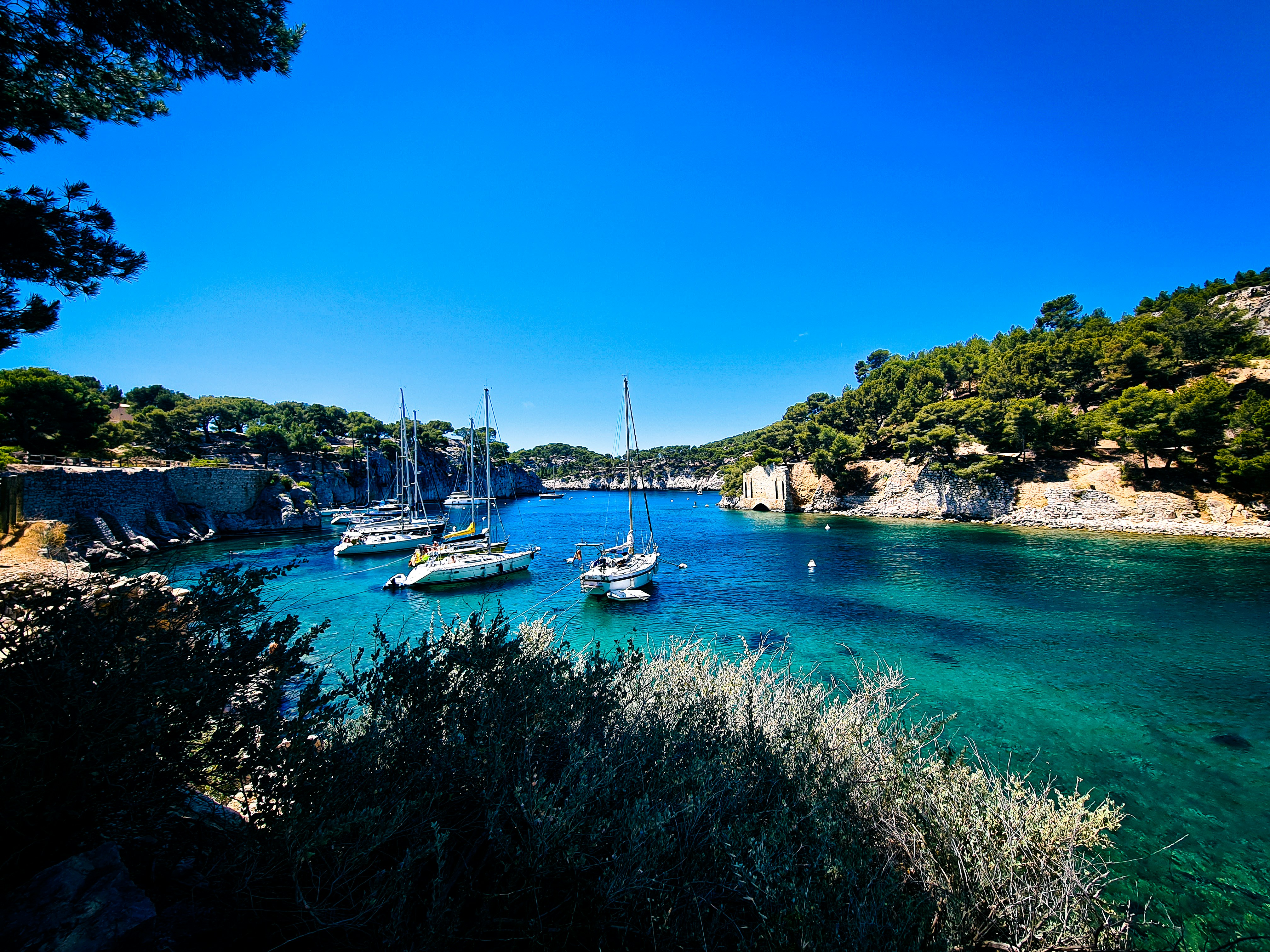 white and blue boat on body of water during daytime, 
