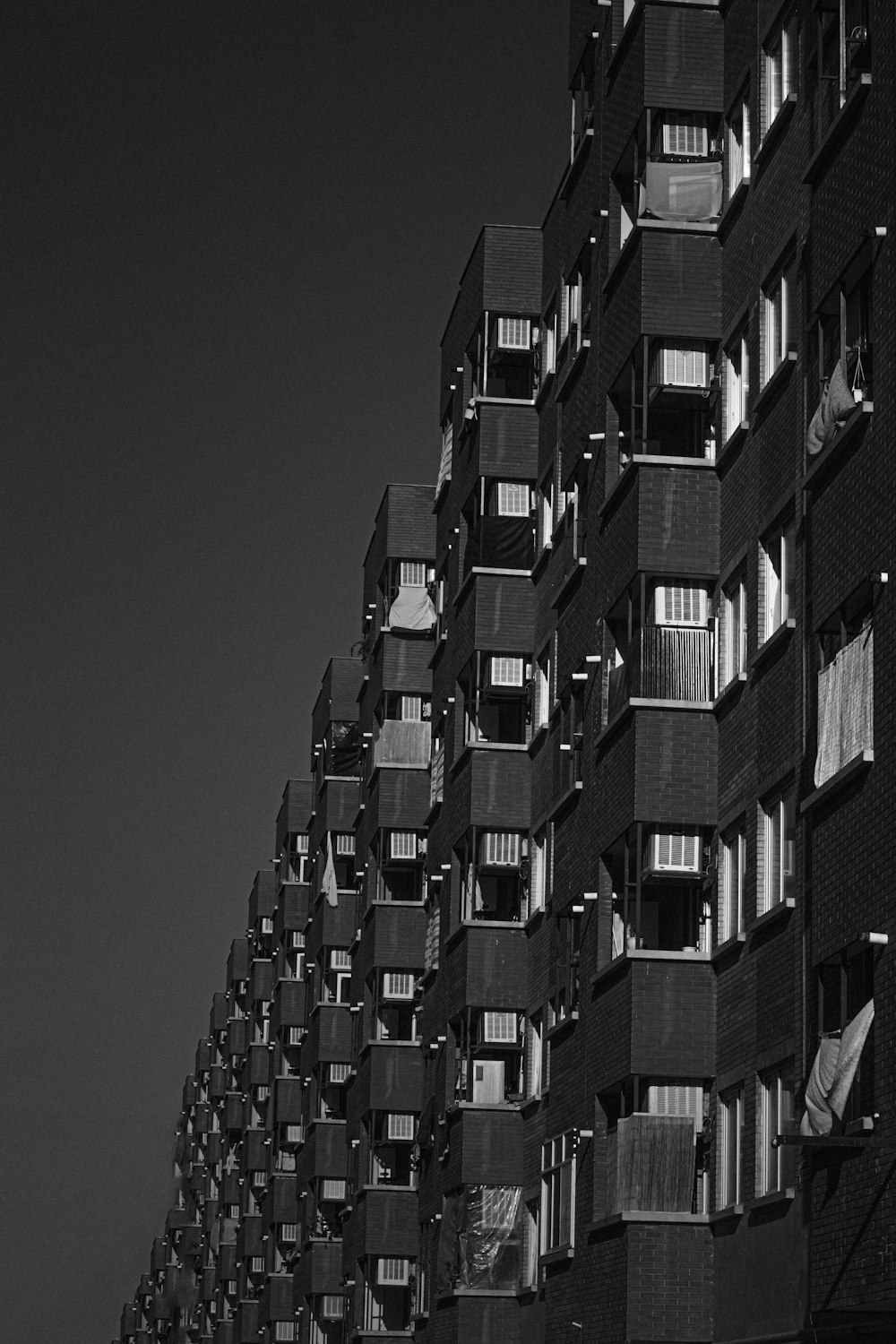 grayscale photo of high rise building