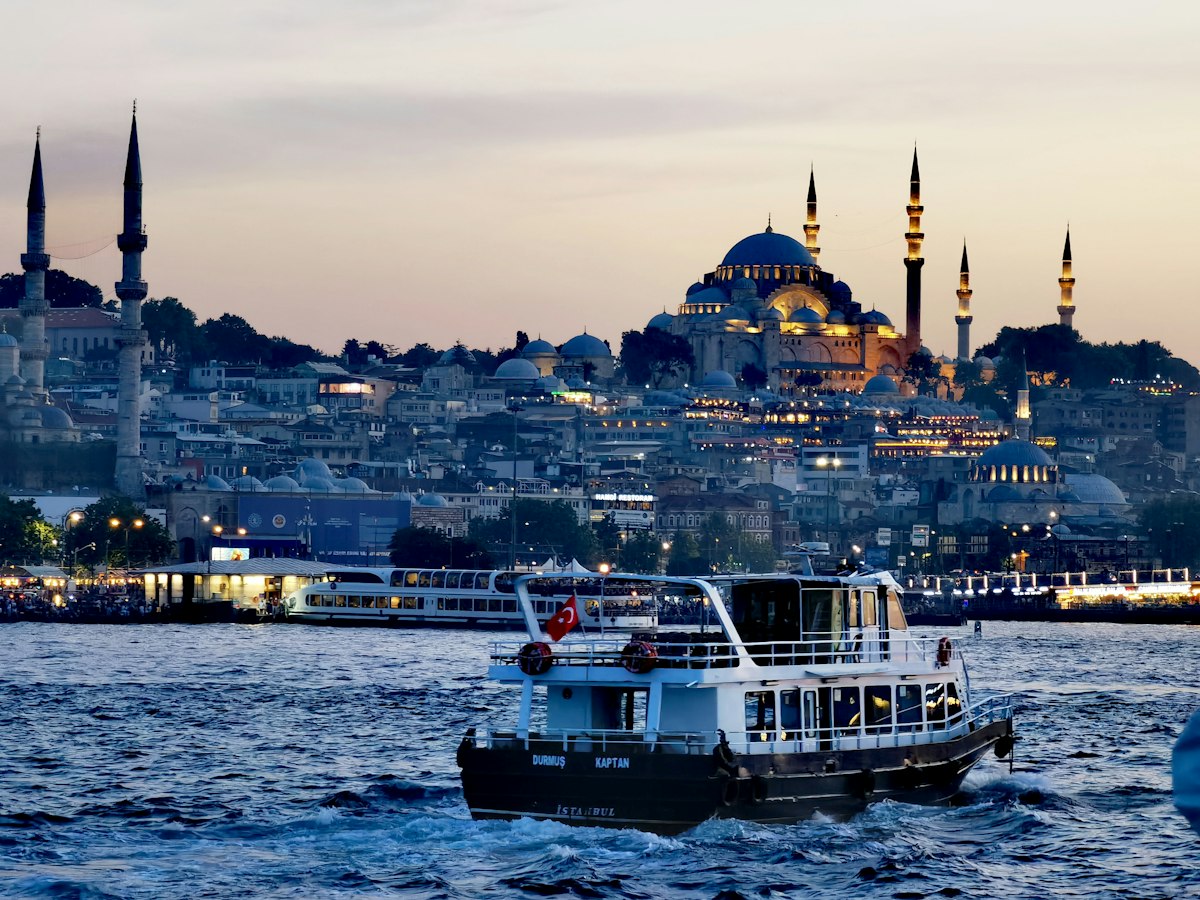 A passenger boat on the Bosphorus with the Süleymaniye Mosque in Istanbul