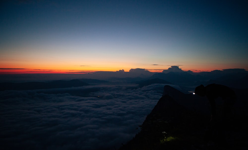 silhouette of mountain during sunset