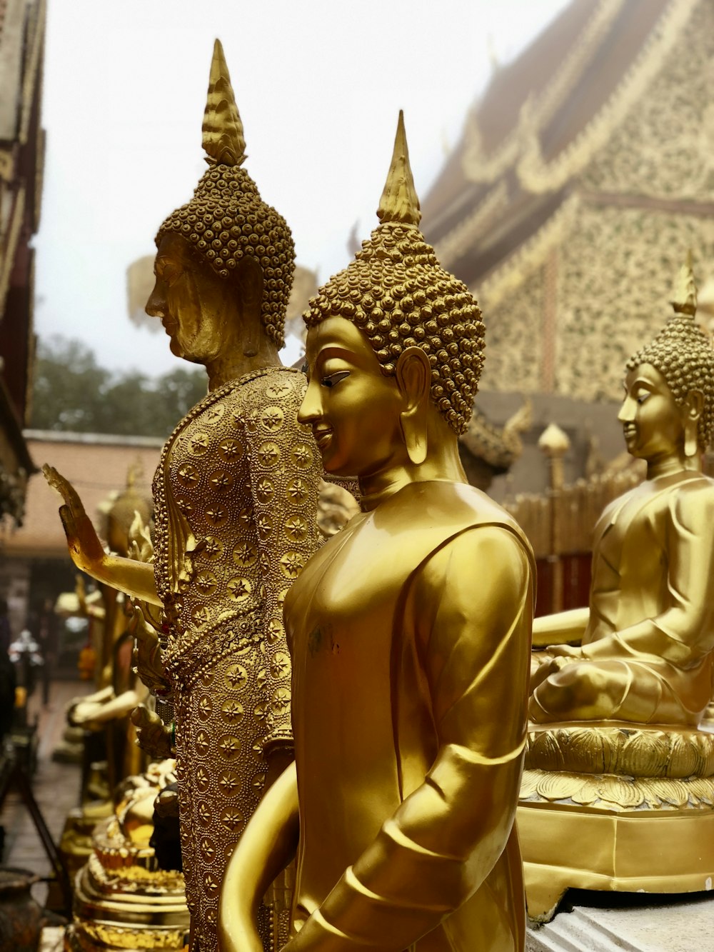 gold buddha statue during daytime