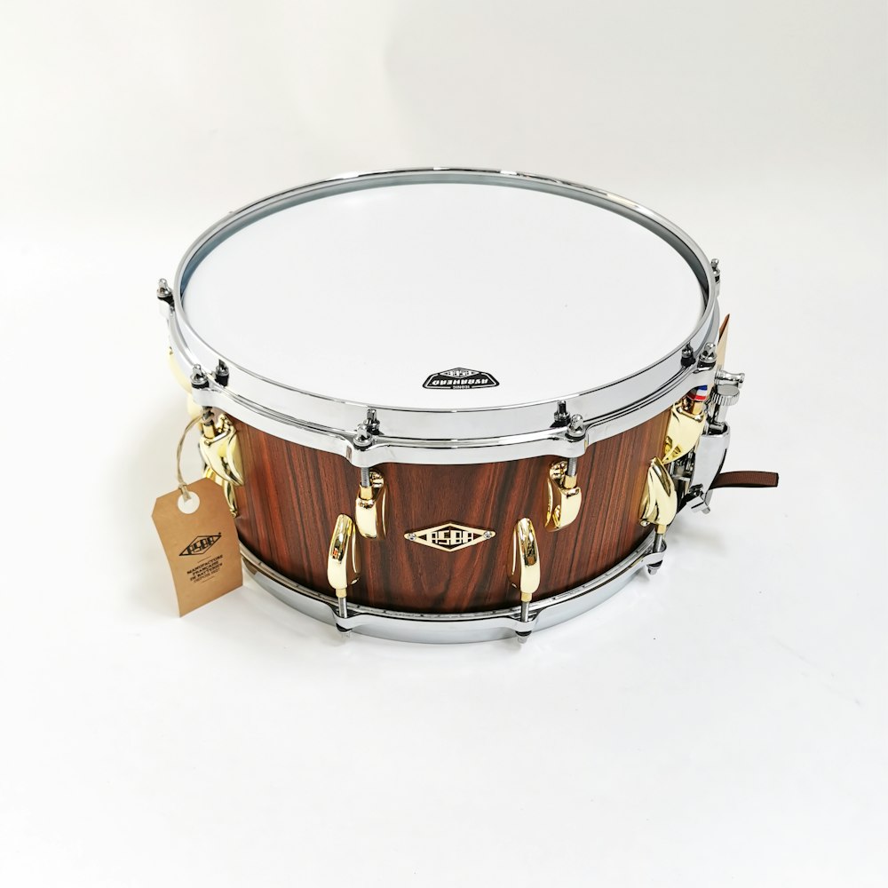 brown and white drum set