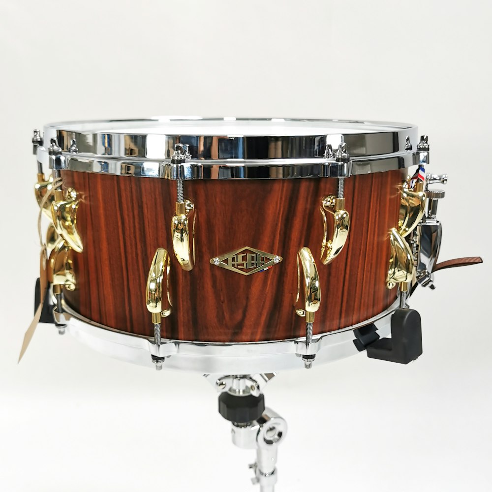 brown and white drum set