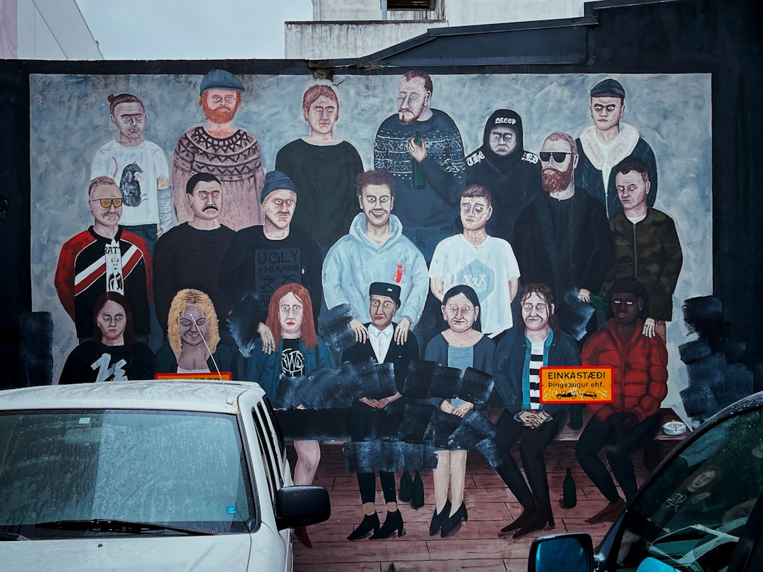 group of people standing beside white car