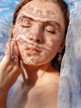 woman with white veil and silver ring