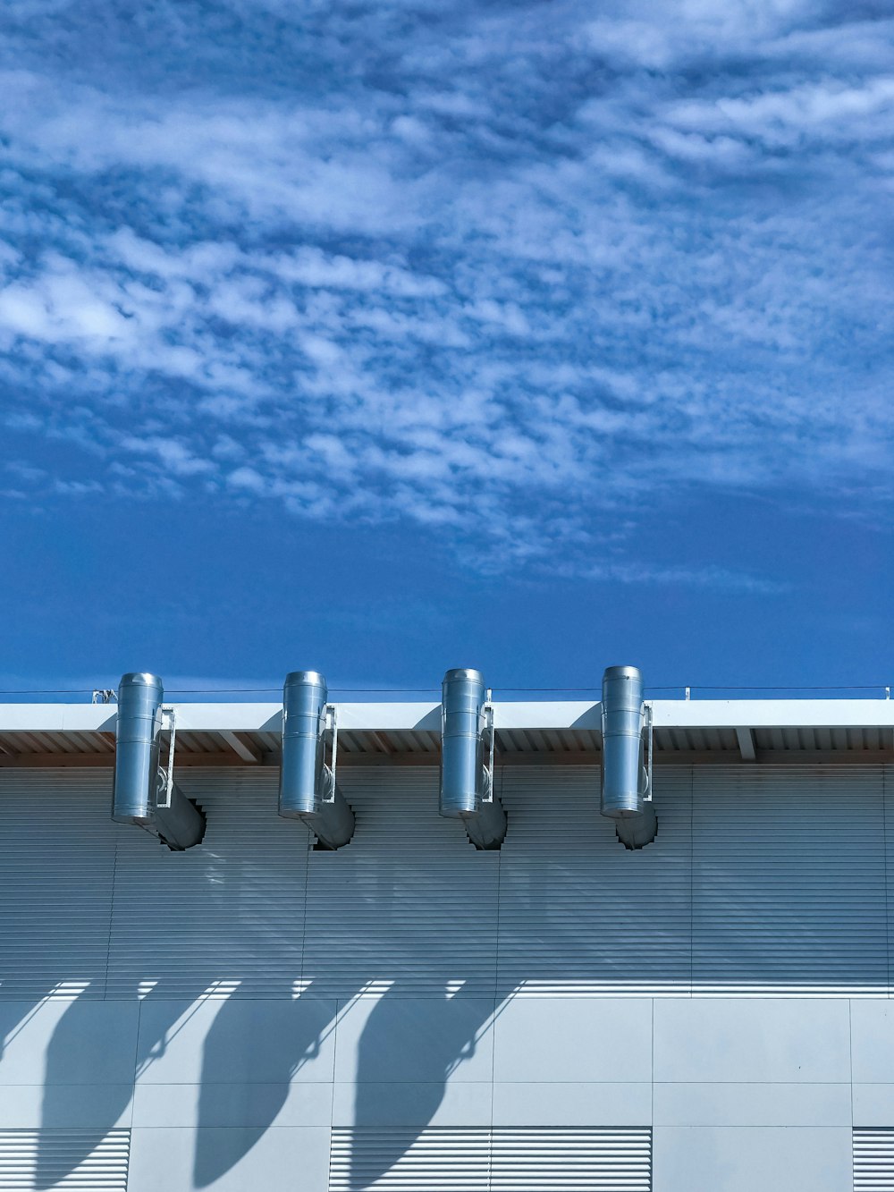 white and gray building under blue sky during daytime