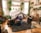 A cozy living space adorned with handmade crafts and plants.