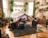 A cozy living space adorned with handmade crafts and plants.