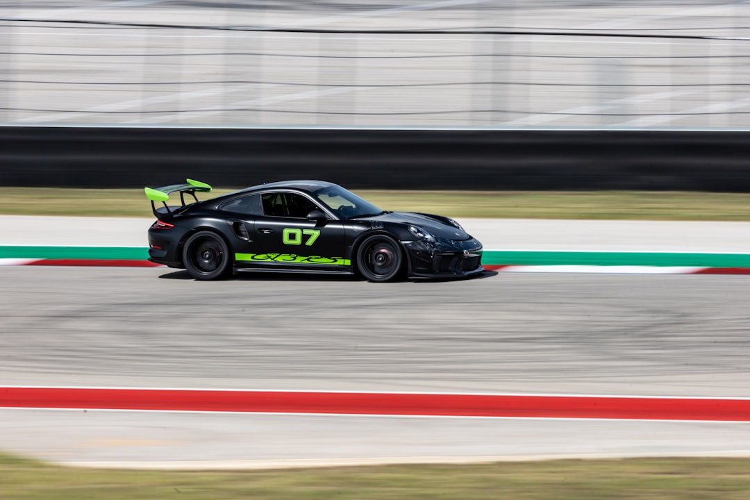 black and green porsche 911 on race track