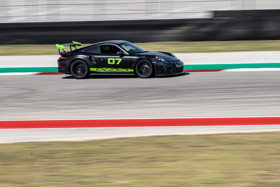 black and green porsche 911 on track