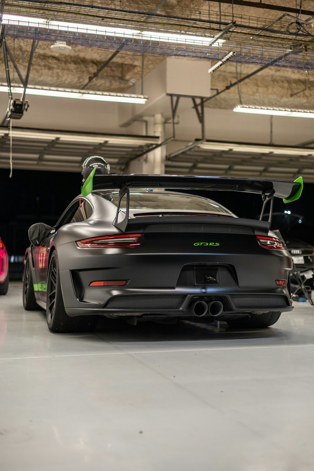 black porsche 911 parked in garage