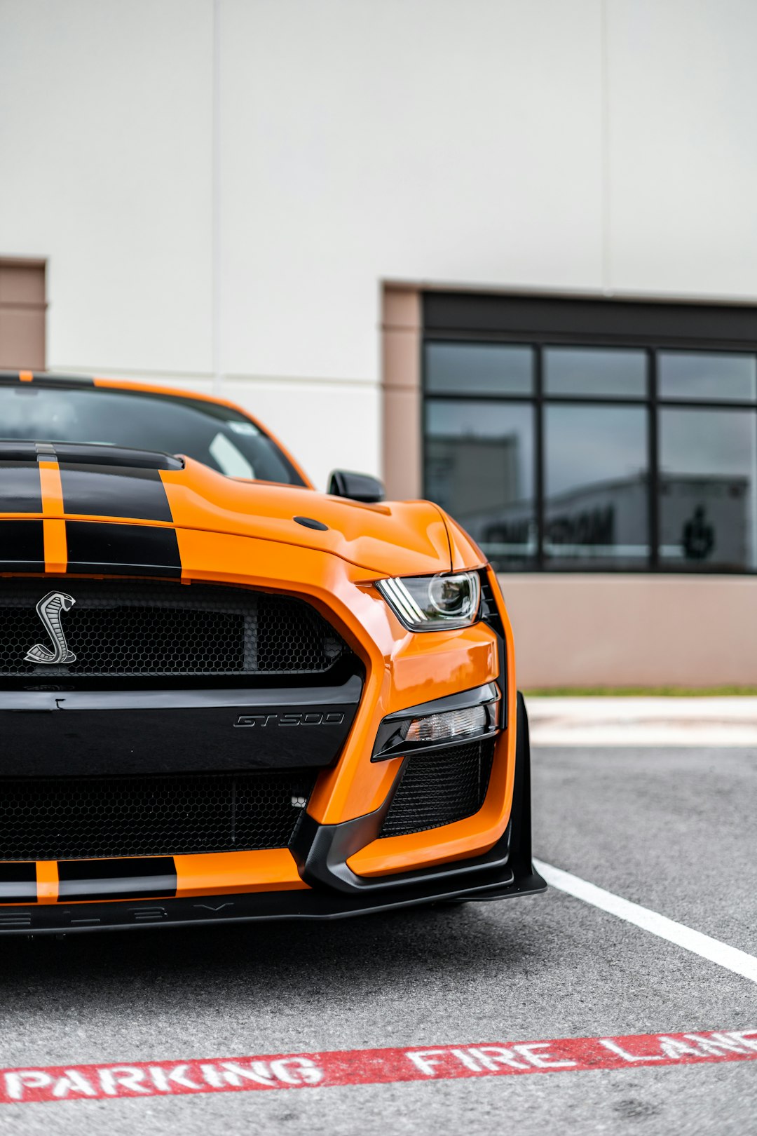 orange and black chevrolet camaro