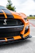 orange and black chevrolet camaro