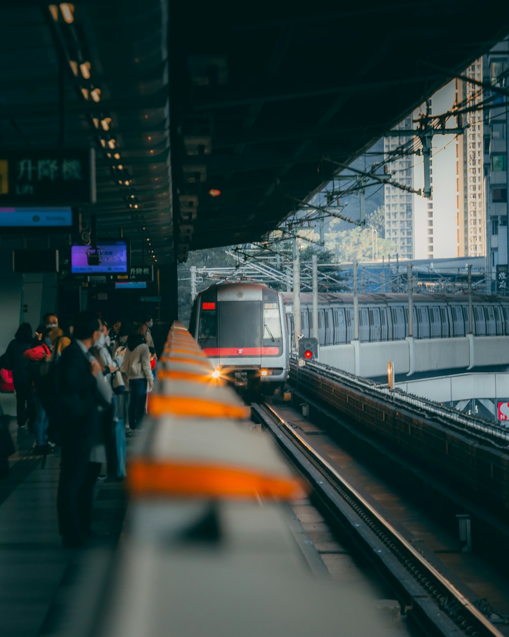 people walking on train station during daytime