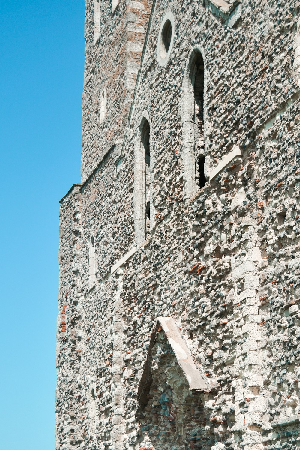 grey concrete building under blue sky during daytime