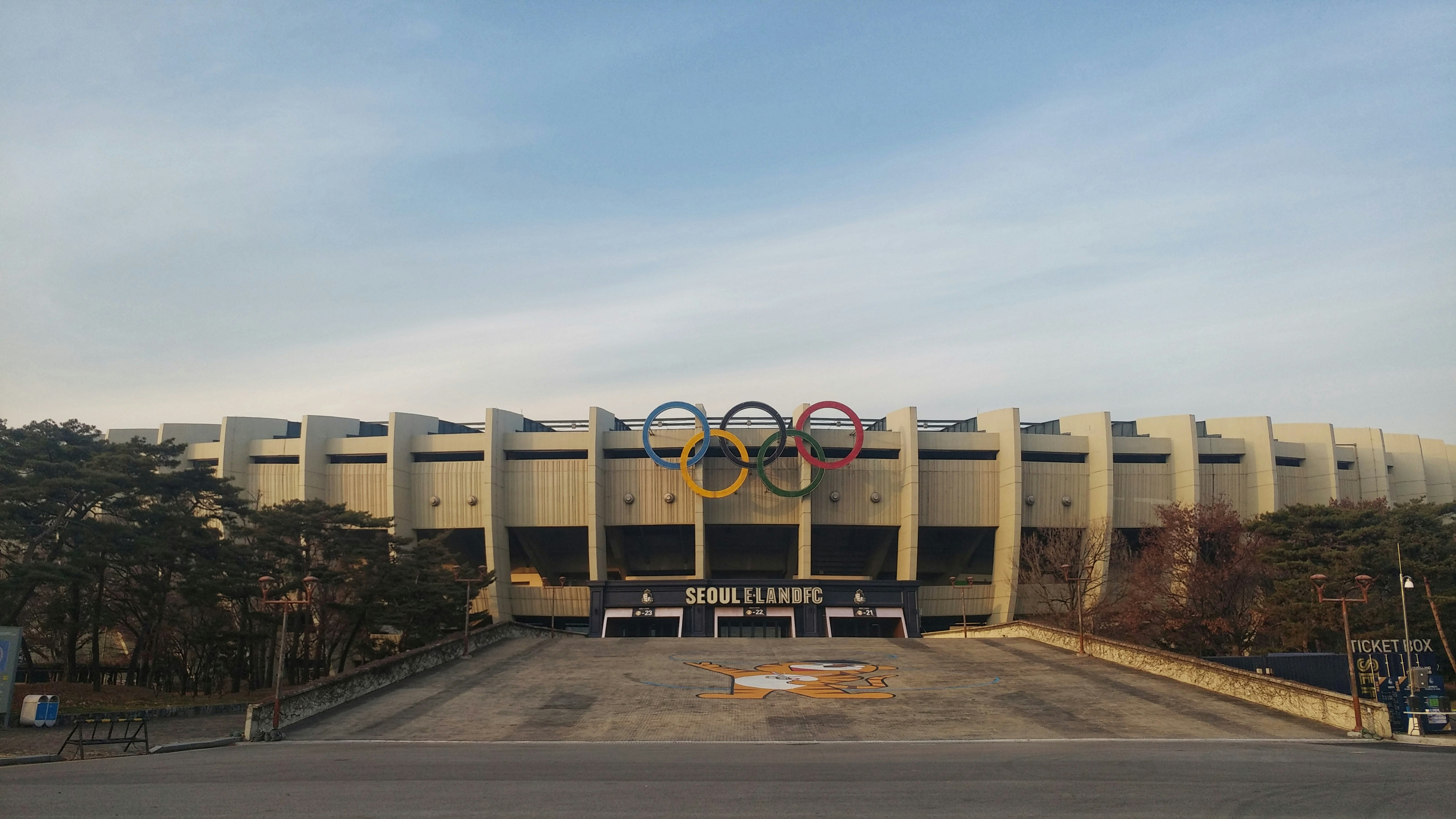 brown wooden cargo containers on gray concrete road during daytime