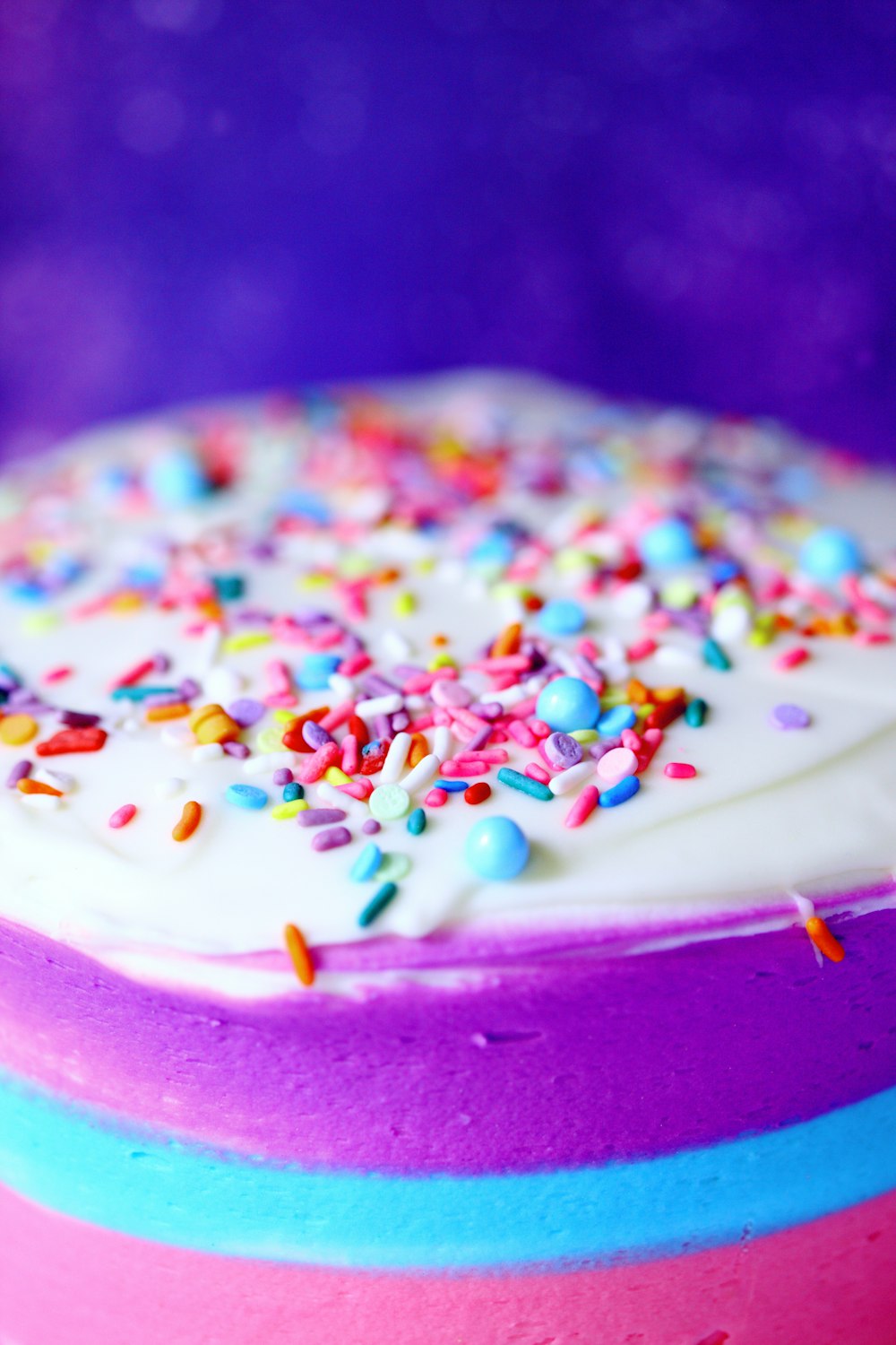 white cream with sprinkles on pink plate