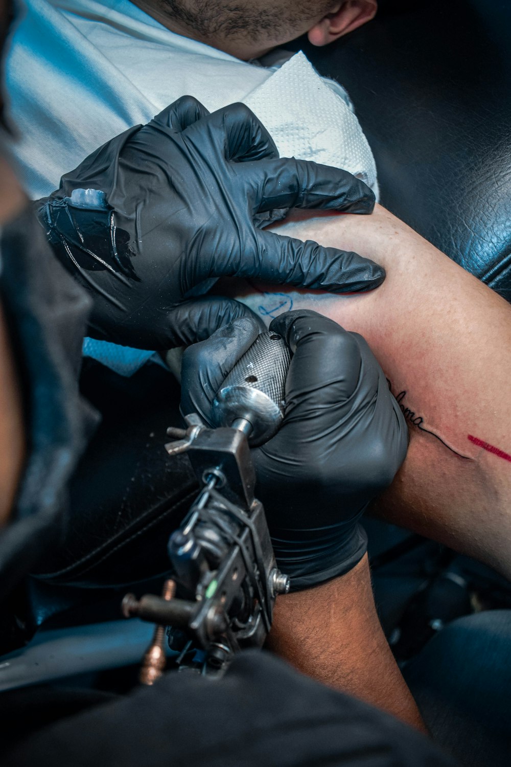 person wearing black leather gloves