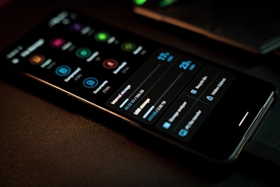 black remote control on brown textile