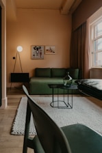 Cozy living room interior featuring contemporary furniture and warm lighting.