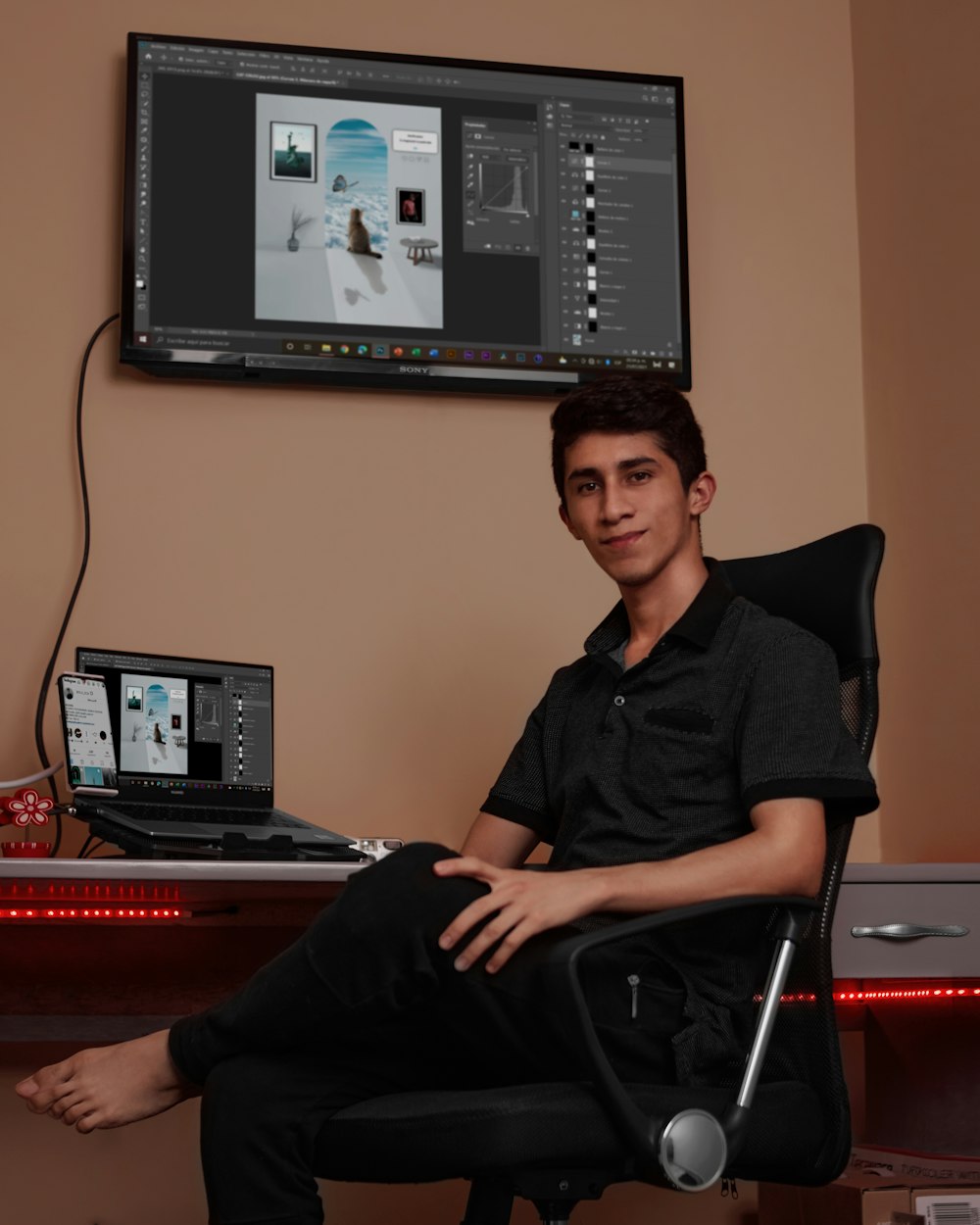 man in black dress shirt sitting on black office rolling chair