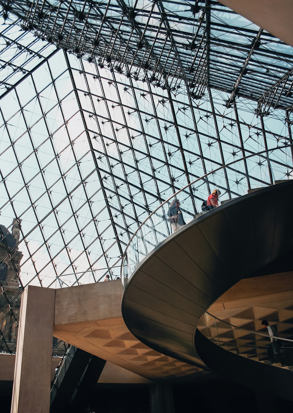 people walking on brown concrete stairs