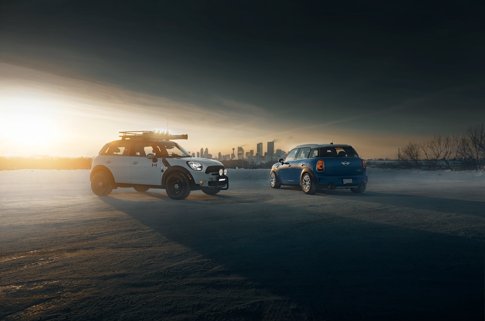 three cars on road during sunset