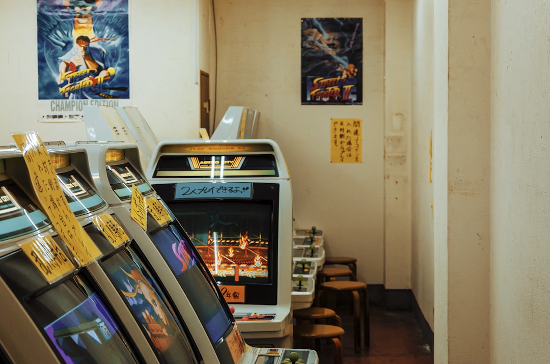 silver flat screen tv on brown wooden tv rack, Arcade machines