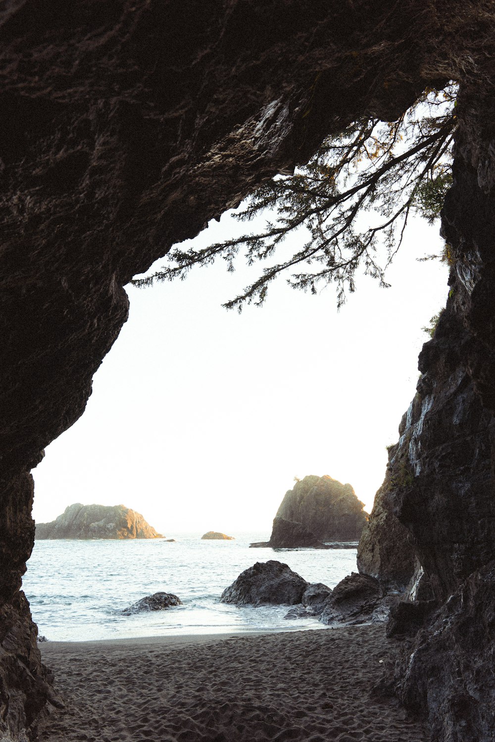 brown rock formation near body of water during daytime