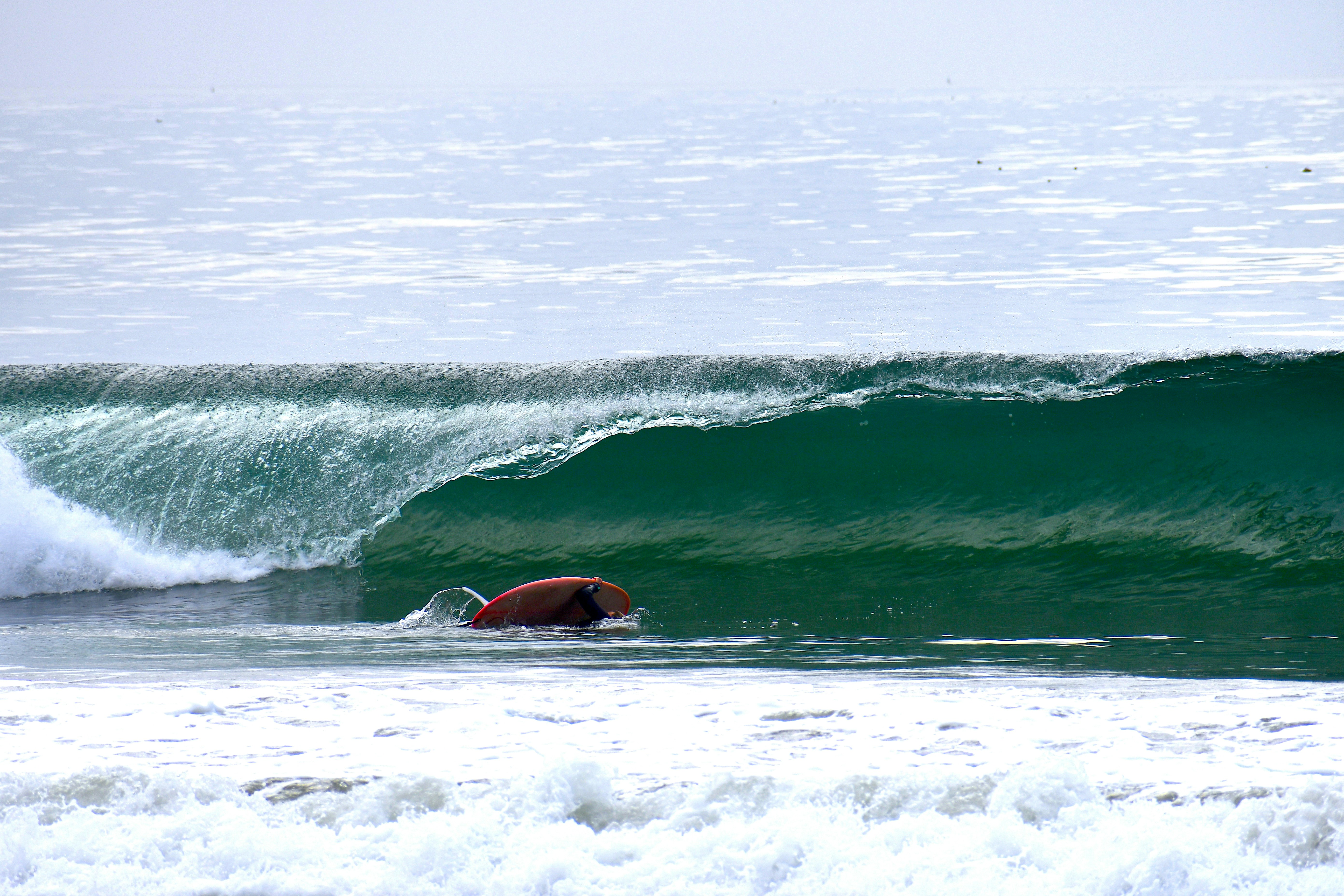 Surfer catching a wave