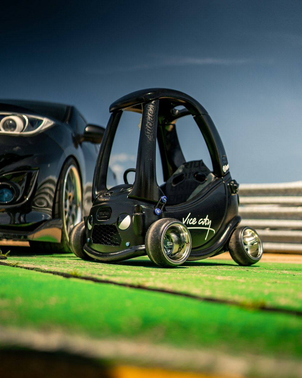 black volkswagen beetle on green grass field during daytime