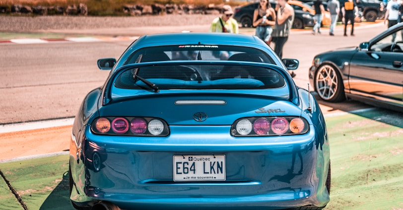 blue bmw m 3 on road during daytime