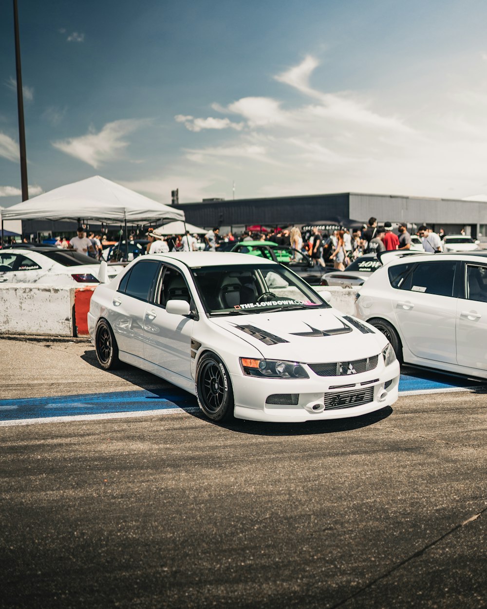 white bmw m 3 on road during daytime