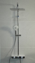 silver shower head mounted on white wall