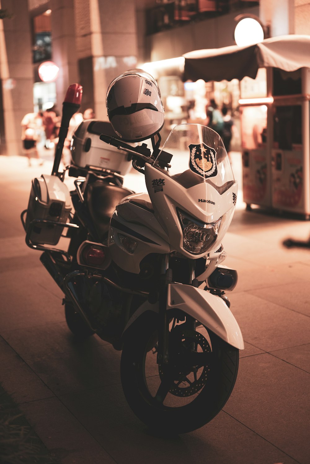 man in red helmet riding on motorcycle