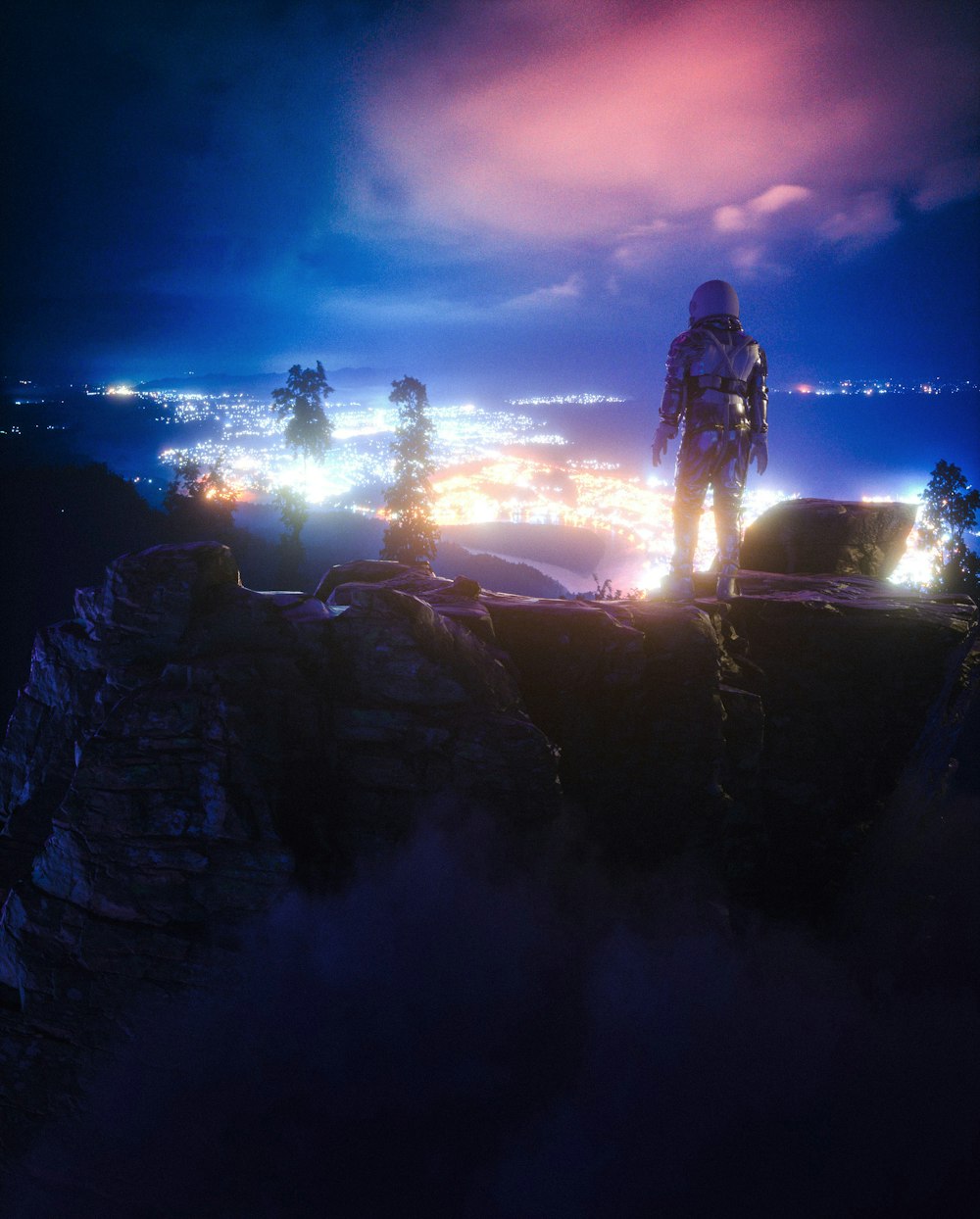 man standing on rock formation during night time