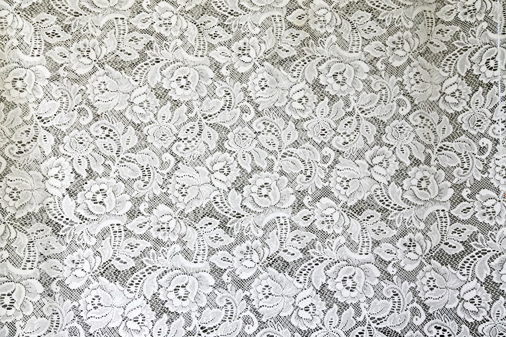 white and black floral textile